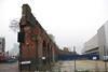 The outer brick wall of Bishopsgate goods yard, left standing alongside Bethnal Green Road